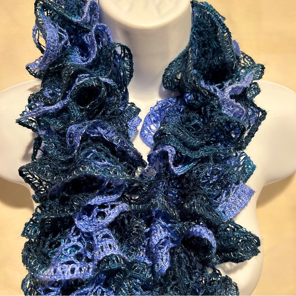 Blue & Multi-Colored knit scarf one size approximately 41 inches long.